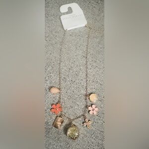 NWT- Maurice's  Style Makers Pressed Flower Necklace with 7 charm pieces.